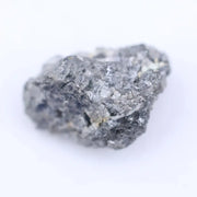 Close-up of rough diamond stone highlighting its natural shape and pristine unpolished surface for jewelry.