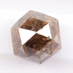 Earth-mined natural brown diamond stone photographed in high resolution, showing real color saturation and natural structure.