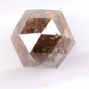 Earth-mined natural brown diamond stone photographed in high resolution, showing real color saturation and natural structure.