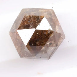 Earth-mined natural brown diamond stone photographed in high resolution, showing real color saturation and natural structure.
