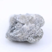 Raw diamond with rugged edges and natural brilliance, perfect for unique handcrafted jewelry designs.