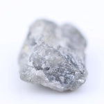 Raw diamond with rugged edges and natural brilliance, perfect for unique handcrafted jewelry designs.