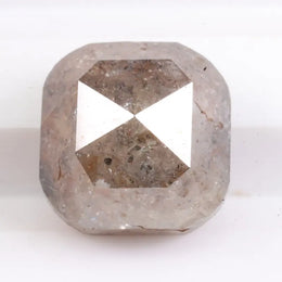 Natural brown diamond engagement ring featuring cushion cut design and genuine earth-mined stone. This image represents luxury, rarity, and emotional value