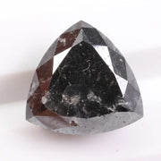 Natural black diamond stone showcasing rare fancy black color, earth-mined origin, and natural crystal formation.