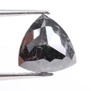 Natural black diamond stone showcasing rare fancy black color, earth-mined origin, and natural crystal formation.