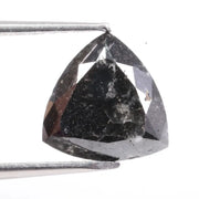 Natural black diamond stone showcasing rare fancy black color, earth-mined origin, and natural crystal formation.