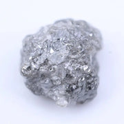 Natural raw diamond with organic shape and textures, showcasing earthy elegance and charm.