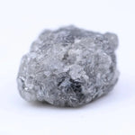 Natural raw diamond with organic shape and textures, showcasing earthy elegance and charm.