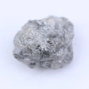 Loose uncut diamond stone in natural rough form showing original crystal surface and natural brilliance