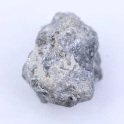 Raw natural diamond crystal before cutting with irregular shape and natural sparkle under light