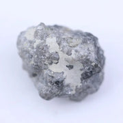 Raw natural diamond crystal before cutting with irregular shape and natural sparkle under light
