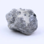 Raw natural diamond crystal before cutting with irregular shape and natural sparkle under light