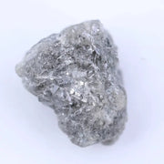 Uncut diamond crystal showing natural octahedral structure and raw gemstone brilliance