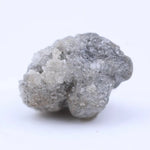 Natural rough diamond stone with original crystal edges and untreated raw gemstone appearance
