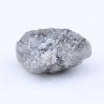 Loose natural raw diamond stone with uneven crystal structure and organic surface texture