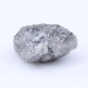 Loose natural raw diamond stone with uneven crystal structure and organic surface texture