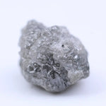 Natural rough diamond for cutting and polishing showing original gemstone formation pattern