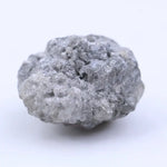 Natural rough diamond for cutting and polishing showing original gemstone formation pattern