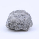 Natural rough diamond for cutting and polishing showing original gemstone formation pattern