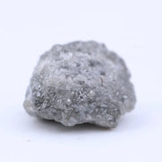Natural rough diamond for cutting and polishing showing original gemstone formation pattern