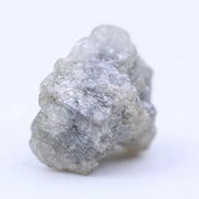 Raw diamond crystal close-up showing natural inclusions and original uncut gemstone structure
