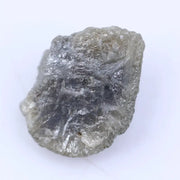 Uncut natural diamond stone with strong crystal edges and raw sparkle in natural light