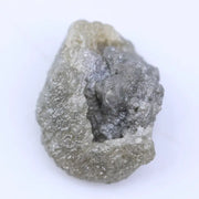 Uncut natural diamond stone with strong crystal edges and raw sparkle in natural light