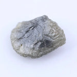 Uncut natural diamond stone with strong crystal edges and raw sparkle in natural light
