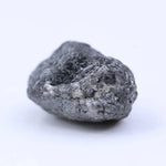 Natural black diamond loose gemstone with deep dark color and raw crystal texture.