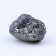 Natural black diamond loose gemstone with deep dark color and raw crystal texture.