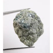 Green rough diamond displayed as a natural loose diamond with irregular diamond shape and raw crystal texture. This real natural diamond stone is uncut and untreated, making it ideal for custom diamond for ring designs, collectors, and buyers seeking authentic green rough diamond material.
