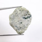 Green rough diamond displayed as a natural loose diamond with irregular diamond shape and raw crystal texture. This real natural diamond stone is uncut and untreated, making it ideal for custom diamond for ring designs, collectors, and buyers seeking authentic green rough diamond material.
