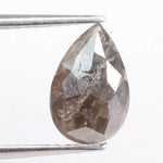 Pear cut natural diamond set in a real natural diamond ring, showcasing precision cutting and natural brilliance.