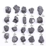 Black diamond with deep dark color displayed in a polished luxury jewelry setting