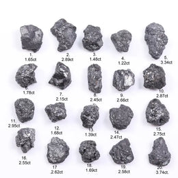 Black diamond with deep dark color displayed in a polished luxury jewelry setting