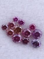 Cluster of pink and red diamonds on a light gray background