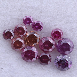 Cluster of pink and red diamonds on a light gray background