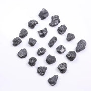 Black diamond with deep dark color displayed in a polished luxury jewelry setting