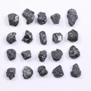 Black diamond with deep dark color displayed in a polished luxury jewelry setting