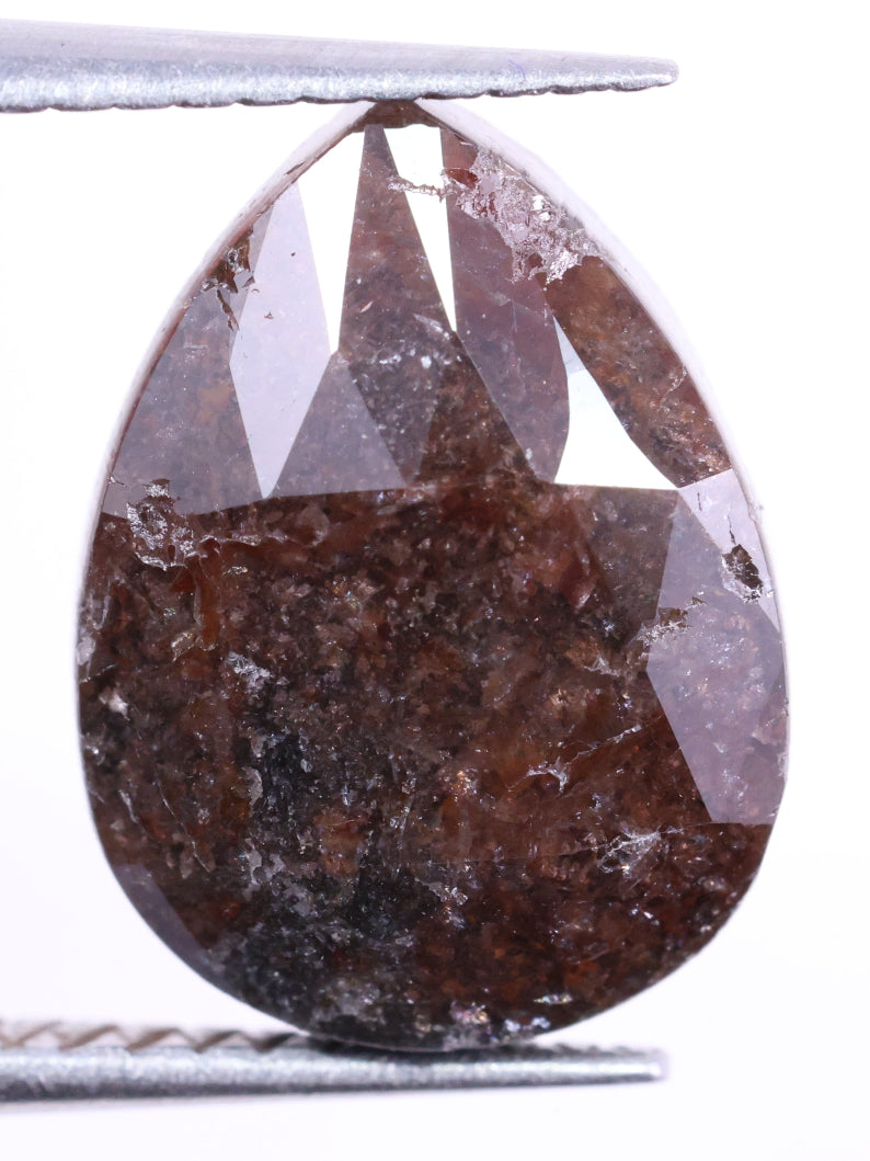 pear-shaped brown diamond on a white background