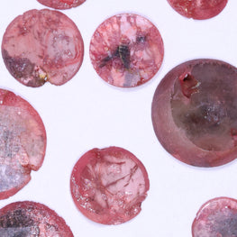Pink raw diamond on a white background