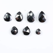 natural pear cut diamond black diamond what is a black diamond, diamond ring, how to tell if a diamond is real, lab grown vs natural diamond, raw diamonds, man made diamonds, GIA certified diamonds, buy loose diamonds.