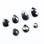 natural pear cut diamond black diamond what is a black diamond, diamond ring, how to tell if a diamond is real, lab grown vs natural diamond, raw diamonds, man made diamonds, GIA certified diamonds, buy loose diamonds.