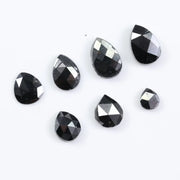 natural pear cut diamond black diamond what is a black diamond, diamond ring, how to tell if a diamond is real, lab grown vs natural diamond, raw diamonds, man made diamonds, GIA certified diamonds, buy loose diamonds.