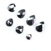 natural pear cut diamond black diamond what is a black diamond, diamond ring, how to tell if a diamond is real, lab grown vs natural diamond, raw diamonds, man made diamonds, GIA certified diamonds, buy loose diamonds.