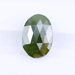 1.55 Ct natural olive green oval cut diamond loose gemstone with visible natural inclusions and faceted surface