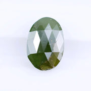 1.55 Ct natural olive green oval cut diamond loose gemstone with visible natural inclusions and faceted surface
