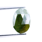 1.55 Ct natural olive green oval cut diamond loose gemstone with visible natural inclusions and faceted surface