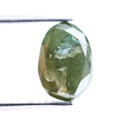 1.55 Ct natural olive green oval cut diamond loose gemstone with visible natural inclusions and faceted surface