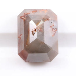 Natural diamond in raw and polished form displaying true earth-mined characteristics. This diamond highlights natural inclusions, clarity variations